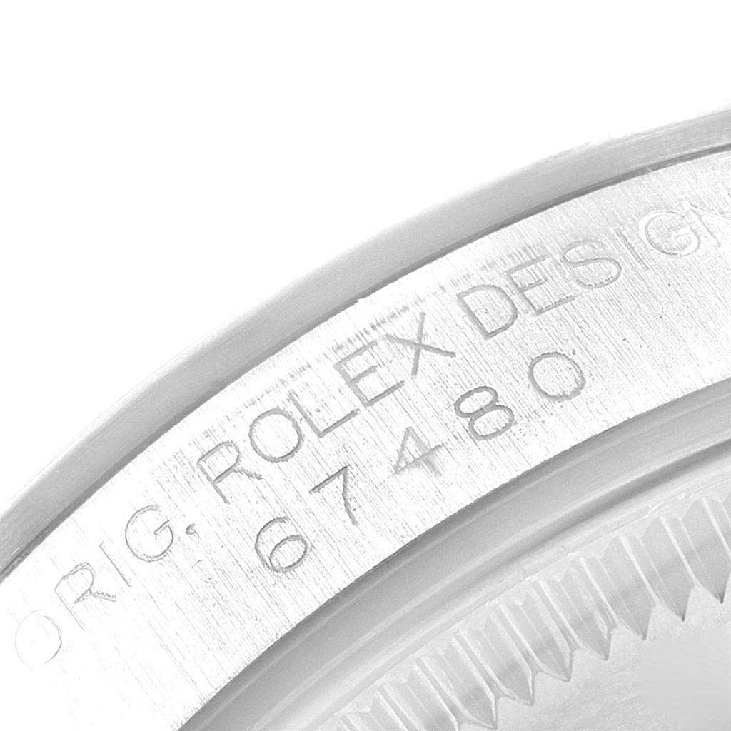 This image shows a close-up of the case back and model number (67480) engraving on a Mid-Size Rolex watch.