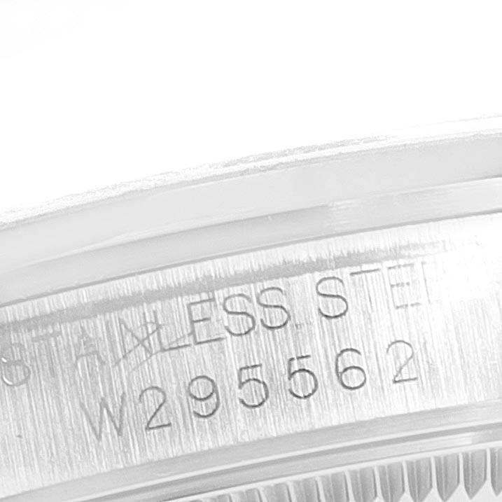 The image shows a macro shot of the serial number engraved on the side of a Rolex Mid-Size 67480 Women's Stainless Steel Pink Dial 67480 Women's Stainless Steel Pink Dial watch case.