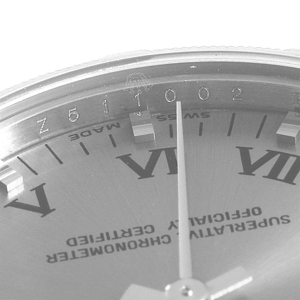 The image shows a close-up of the Rolex Mid-Size 177210 Women's Stainless Steel Silver Dial 177210 Women's Stainless Steel Silver Dial watch's dial and part of the rehaut with engraved serial number.