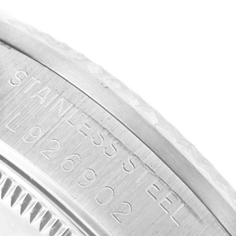 This image shows a close-up angle of the serial number and stainless steel marking on the bezel of a Rolex Mid-Size 68274 Women's Stainless Steel Silver Dial 68274 Women's Stainless Steel Silver Dial watch.