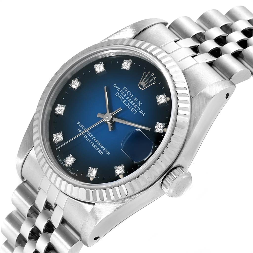 This image shows a Rolex Mid-Size 68274 Women's Stainless Steel Blue Dial 68274 Women's Stainless Steel Blue Dial Datejust from a slightly angled top view, highlighting the face, crown, and part of the bracelet.