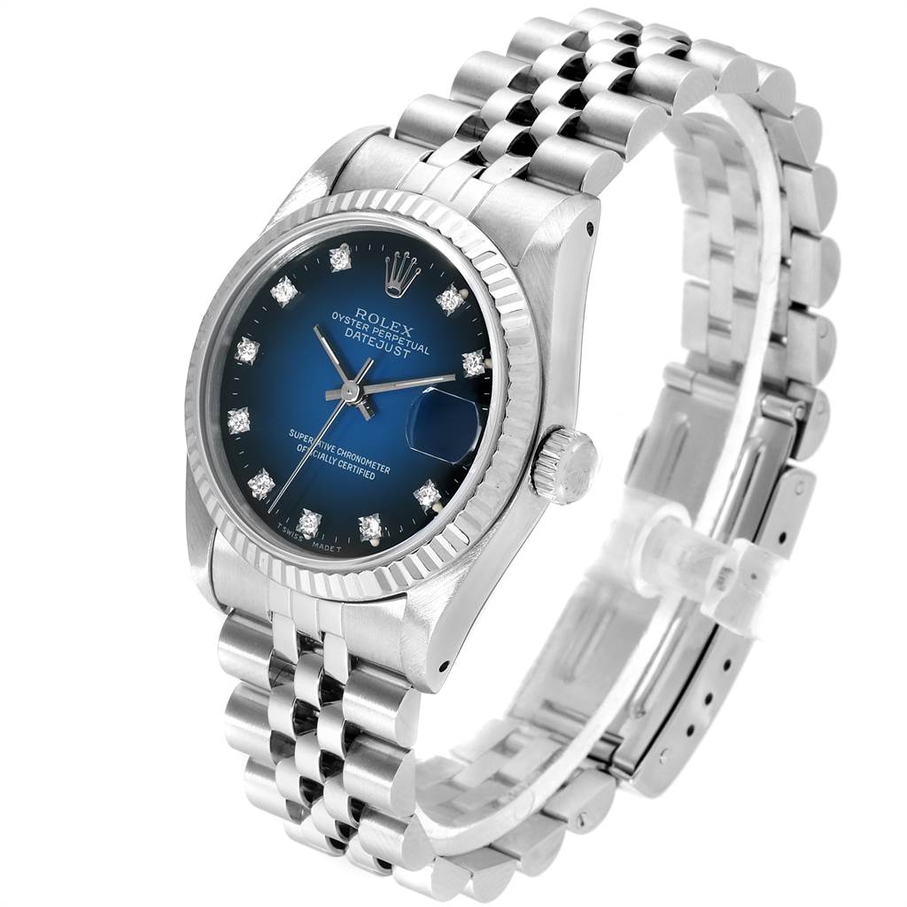The image shows a Rolex Mid-Size 68274 Women's Stainless Steel Blue Dial 68274 Women's Stainless Steel Blue Dial Datejust watch at an angle highlighting its face, bezel, crown, and stainless steel bracelet.