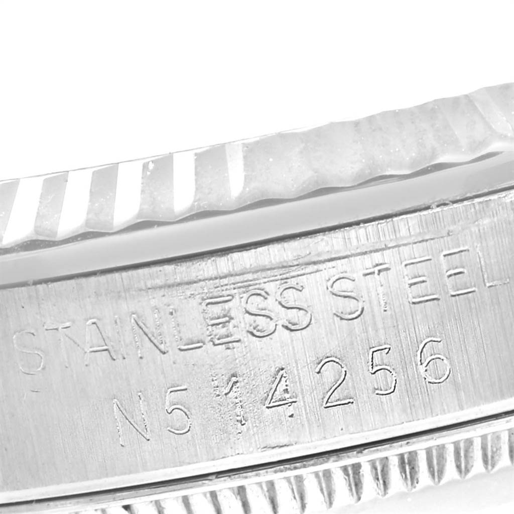 This close-up angle shows the stainless steel casing and part of the bezel of a Rolex Mid-Size 68274 Women's Stainless Steel Pink Dial 68274 Women's Stainless Steel Pink Dial model watch.