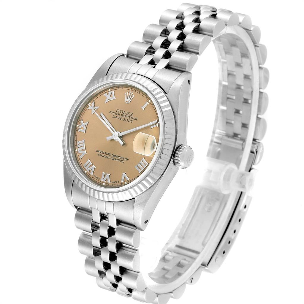 This image showcases the Rolex Mid-Size 68274 Women's Stainless Steel Pink Dial 68274 Women's Stainless Steel Pink Dial Oyster Perpetual Datejust from a three-quarter angle, focusing on its face, crown, and bracelet.