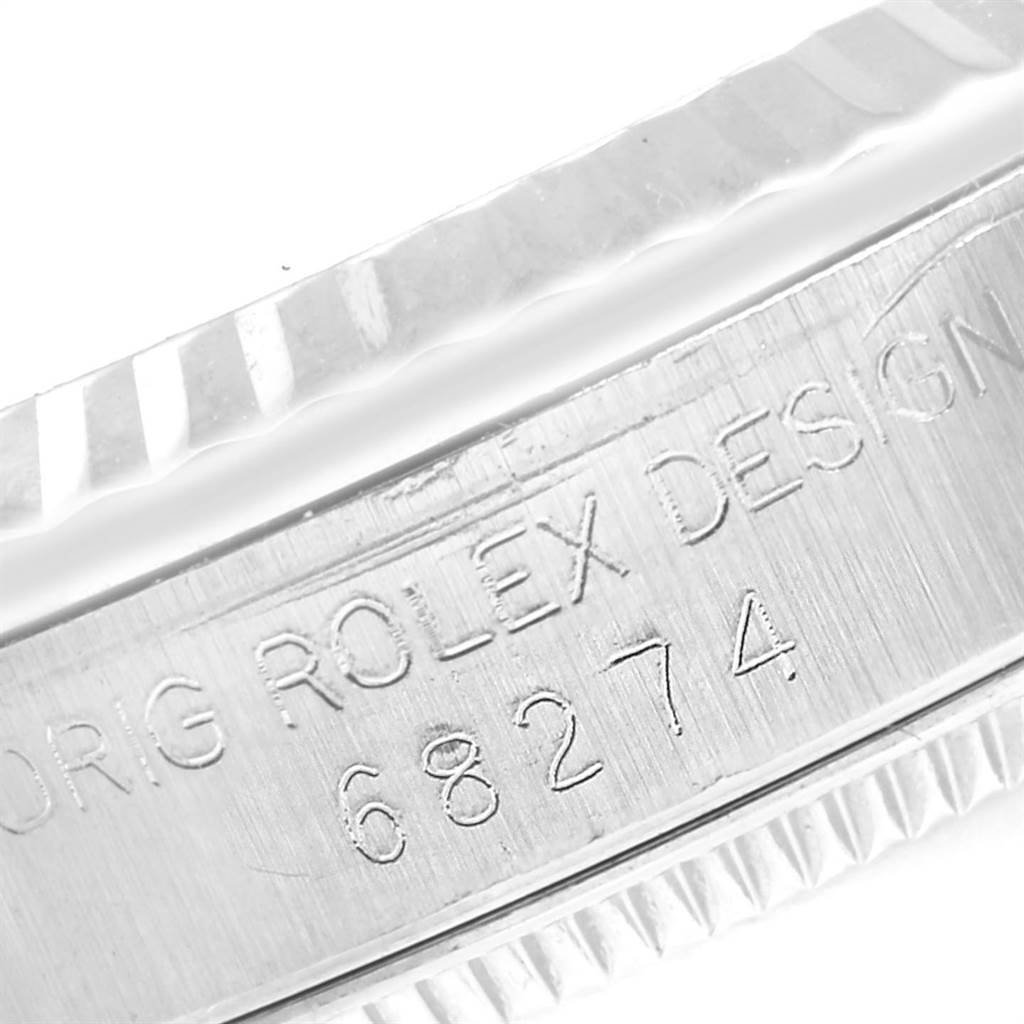 This close-up image shows the engraved model number 68274 and the bezel of a mid-size Rolex watch.