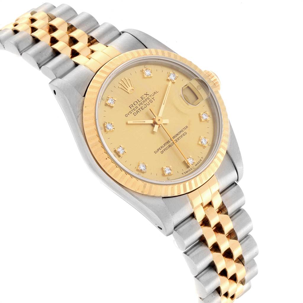 The photo shows a Mid-Size Rolex Datejust watch at an angled top view, highlighting the dial, bezel, and bracelet.