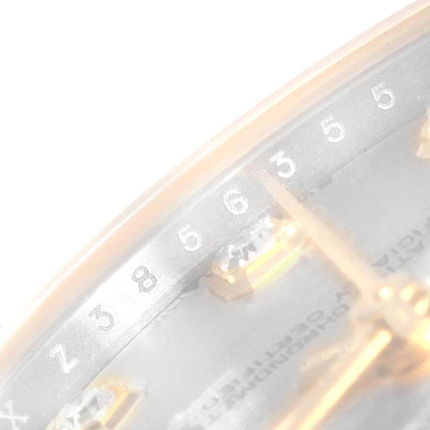 This image shows a close-up of the face and gold hands of a Rolex Mid-Size 178273 Women's Steel and Gold (two tone) Silver Dial 178273 Women's Steel and Gold (two tone) Silver Dial watch, taken at an oblique angle.