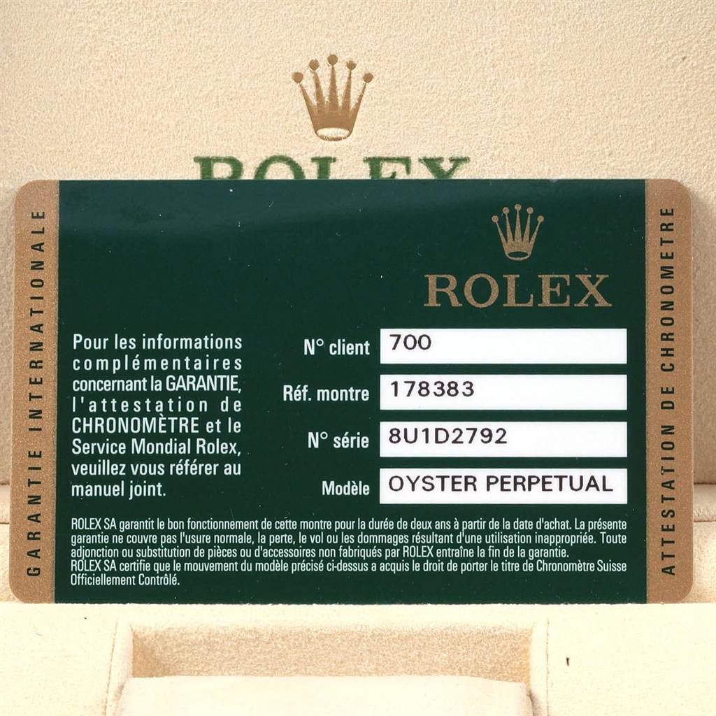 The image shows an official warranty card for the Rolex Oyster Perpetual mid-size model.