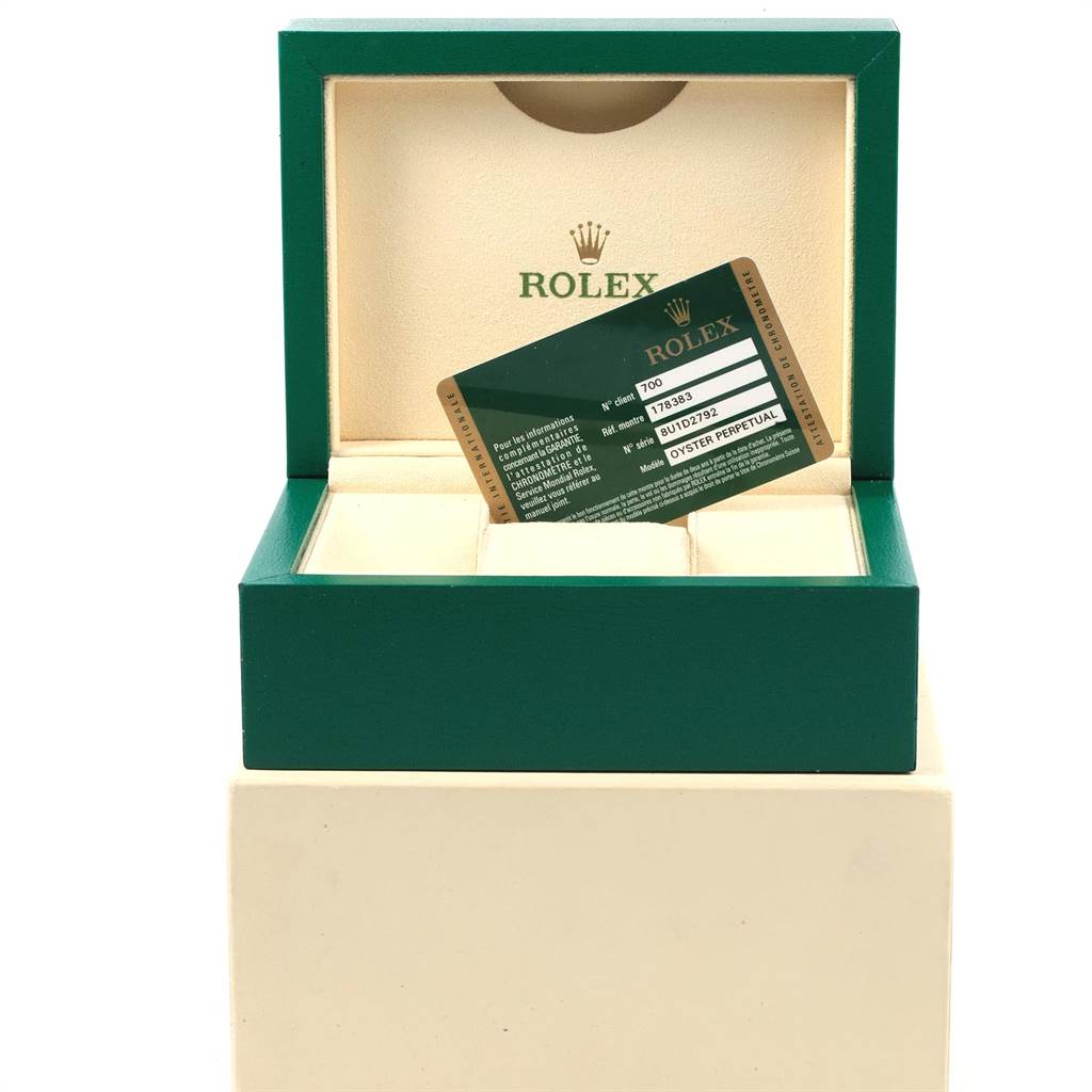 This image shows an open Rolex watch box with a warranty card for a Mid-Size Rolex model.