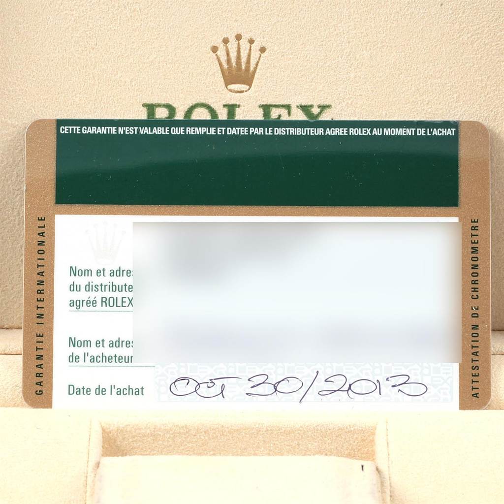 The image shows a close-up of the warranty card for a Mid-Size Rolex watch, within a Rolex box.