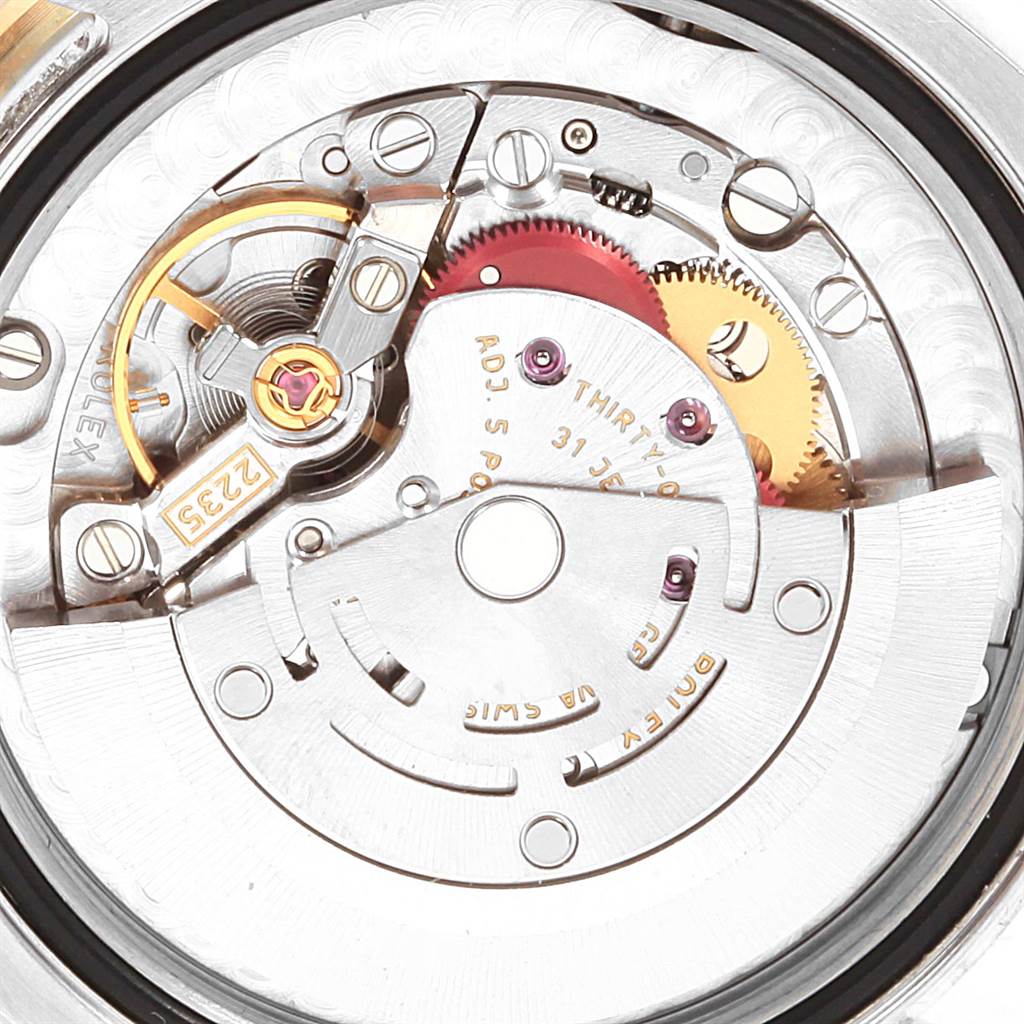 This is a close-up view of the internal movement mechanism of a Rolex Mid-Size 178383 Women's Steel and Gold (two tone) Champagne Dial 178383 Women's Steel and Gold (two tone) Champagne Dial model watch, showing gears and mechanical components.
