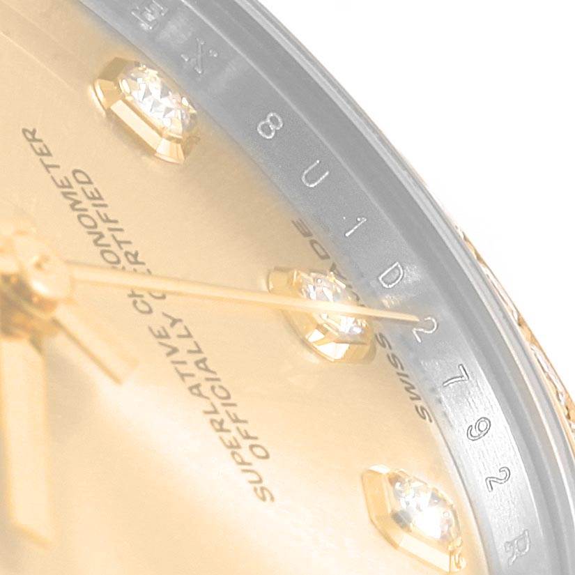 The image shows a close-up of the dial and part of the bezel of a Mid-Size Rolex watch, highlighting the diamond hour markers and text details.