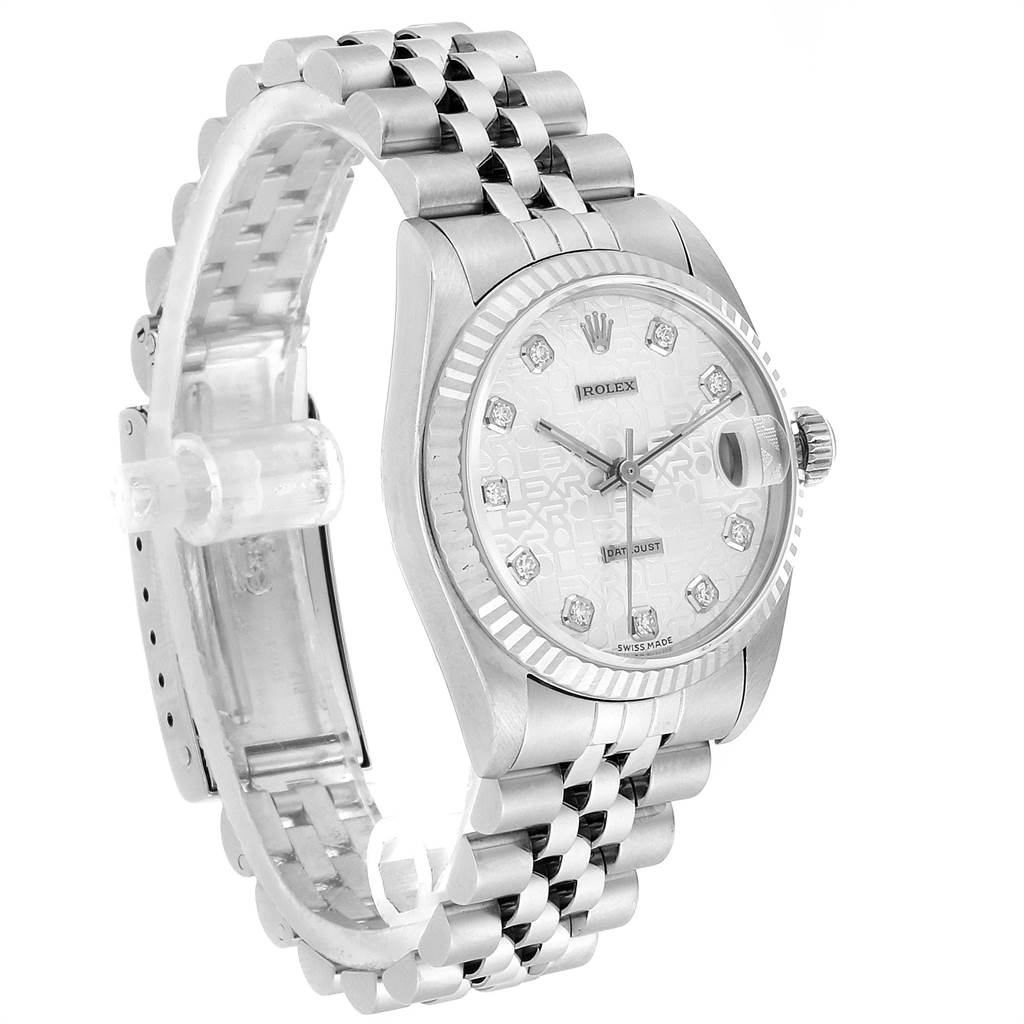 The image shows a side angle view of a Rolex Mid-Size 68274 Women's Stainless Steel Silver Dial 68274 Women's Stainless Steel Silver Dial model watch, highlighting the face, bezel, crown, and jubilee bracelet.