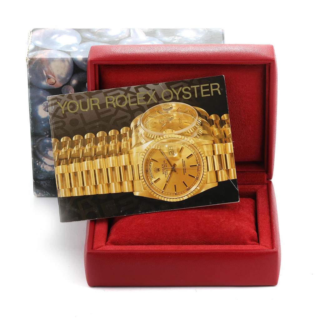 The image shows a Rolex Mid-Size 68274 Women's Stainless Steel Silver Dial 68274 Women's Stainless Steel Silver Dial model's packaging and an instructional booklet, placed in an open red watch box.