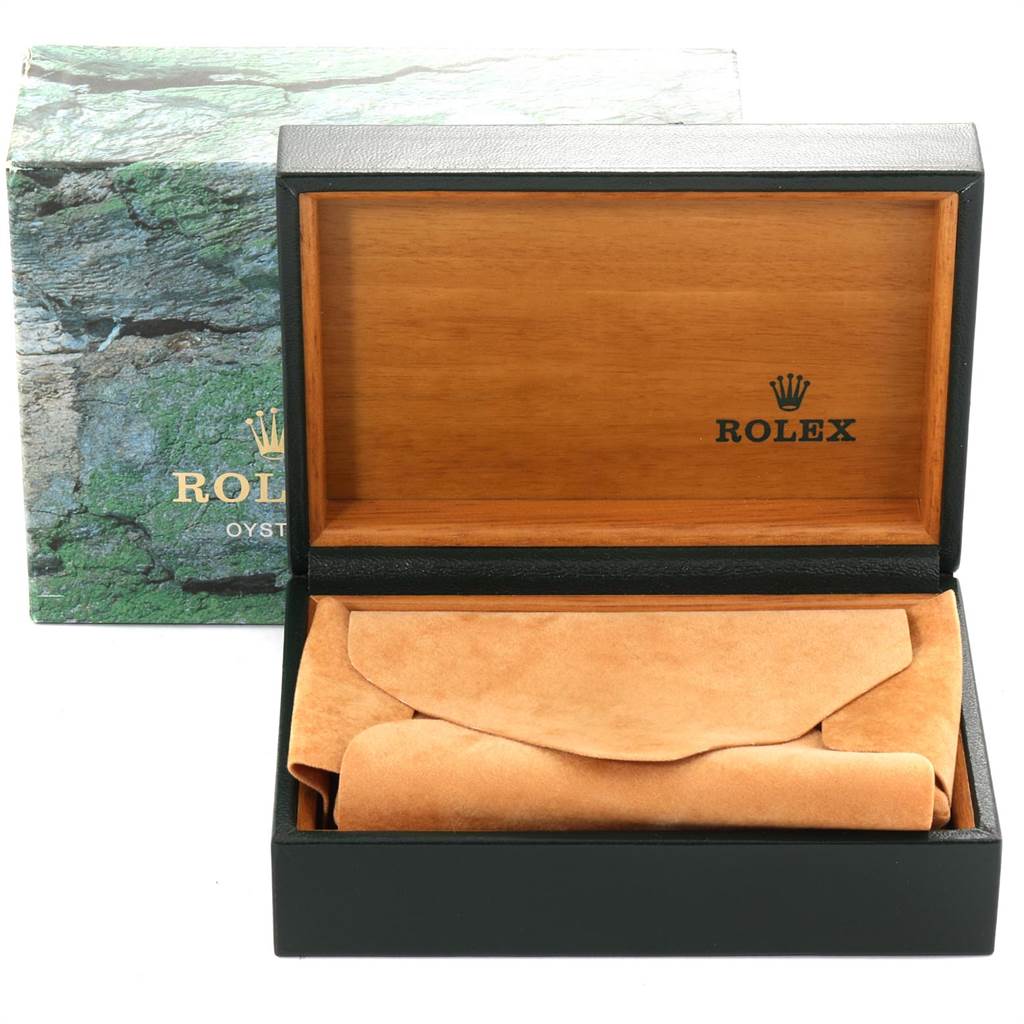 The image shows an open Rolex watch box with a wrapped accessory for the Mid-Size model.