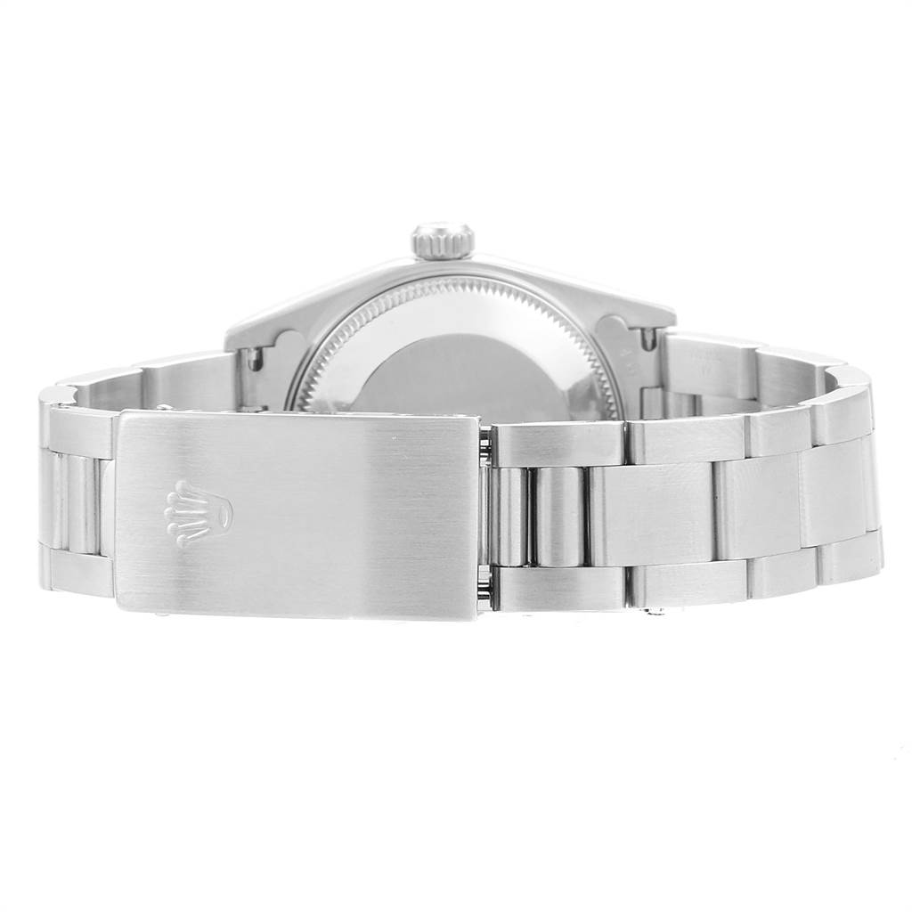 This image shows a rear view of the case and bracelet clasp of a Mid-Size Rolex watch.