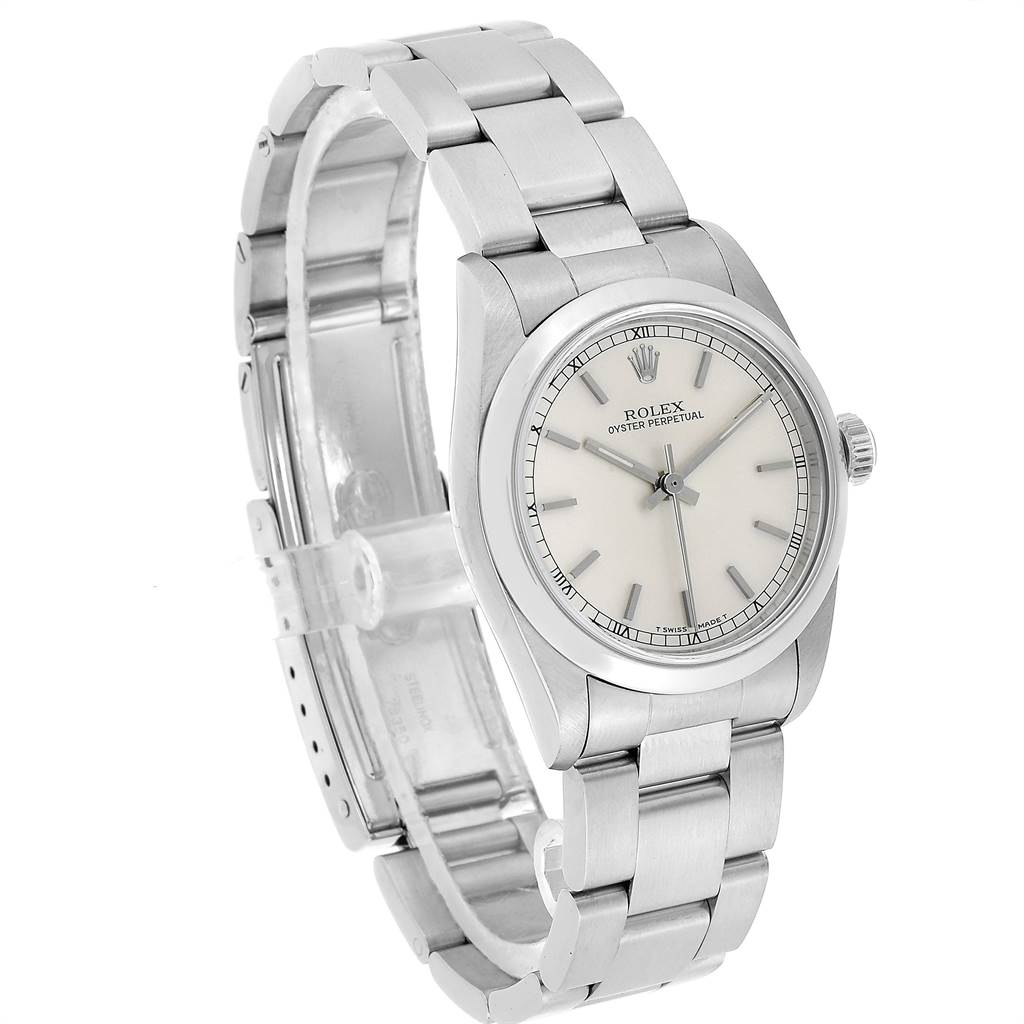 The image shows a mid-size Rolex Oyster Perpetual watch at a three-quarter angle, displaying the dial, case, crown, and stainless steel bracelet.