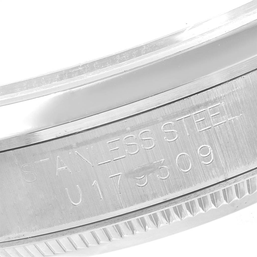This is a close-up of the stainless steel casing and model number of a Rolex Mid-Size 67480 Women's Stainless Steel Silver Dial 67480 Women's Stainless Steel Silver Dial watch.