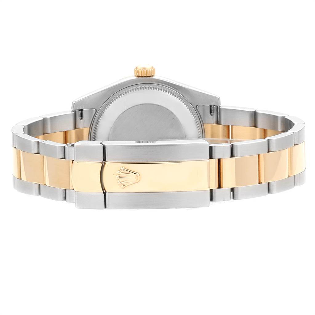 This image shows the back case and clasp of a Mid-Size Rolex watch, featuring a two-tone metal bracelet.