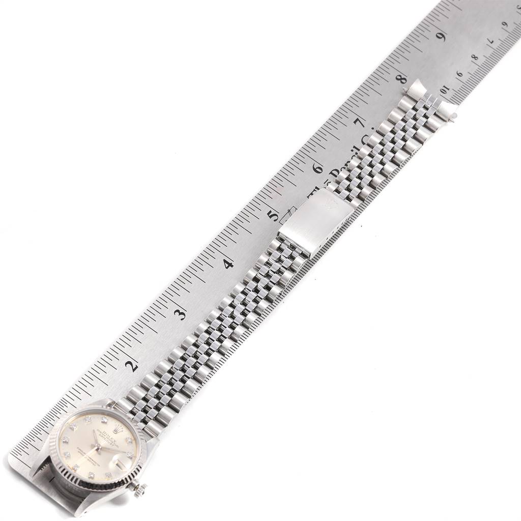 The Rolex Mid-Size 68274 Women's Stainless Steel Silver Dial 68274 Women's Stainless Steel Silver Dial watch is displayed from an overhead perspective, showing the face, crown, and full length of the metal bracelet.