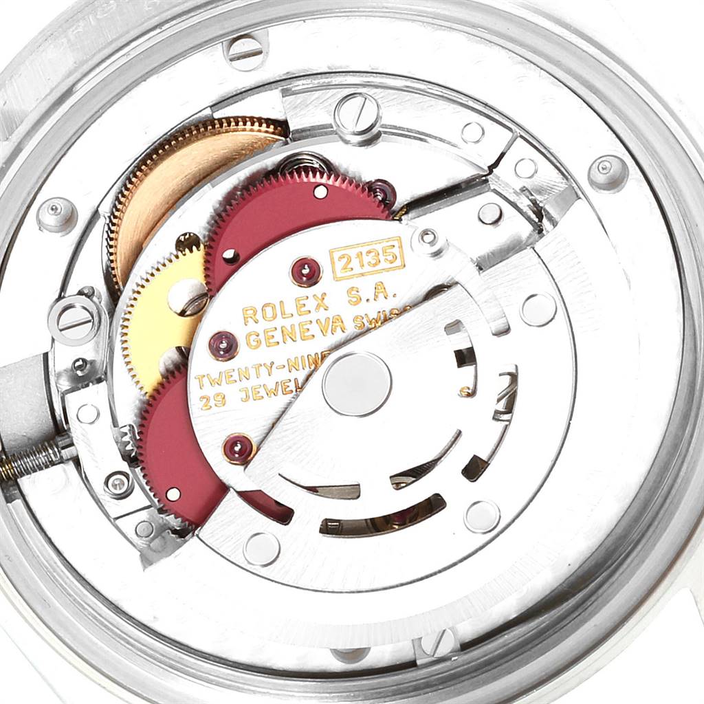 This image displays the intricate internal mechanism of a Rolex Mid-Size 68274 Women's Stainless Steel Silver Dial 68274 Women's Stainless Steel Silver Dial watch from a close-up angle.