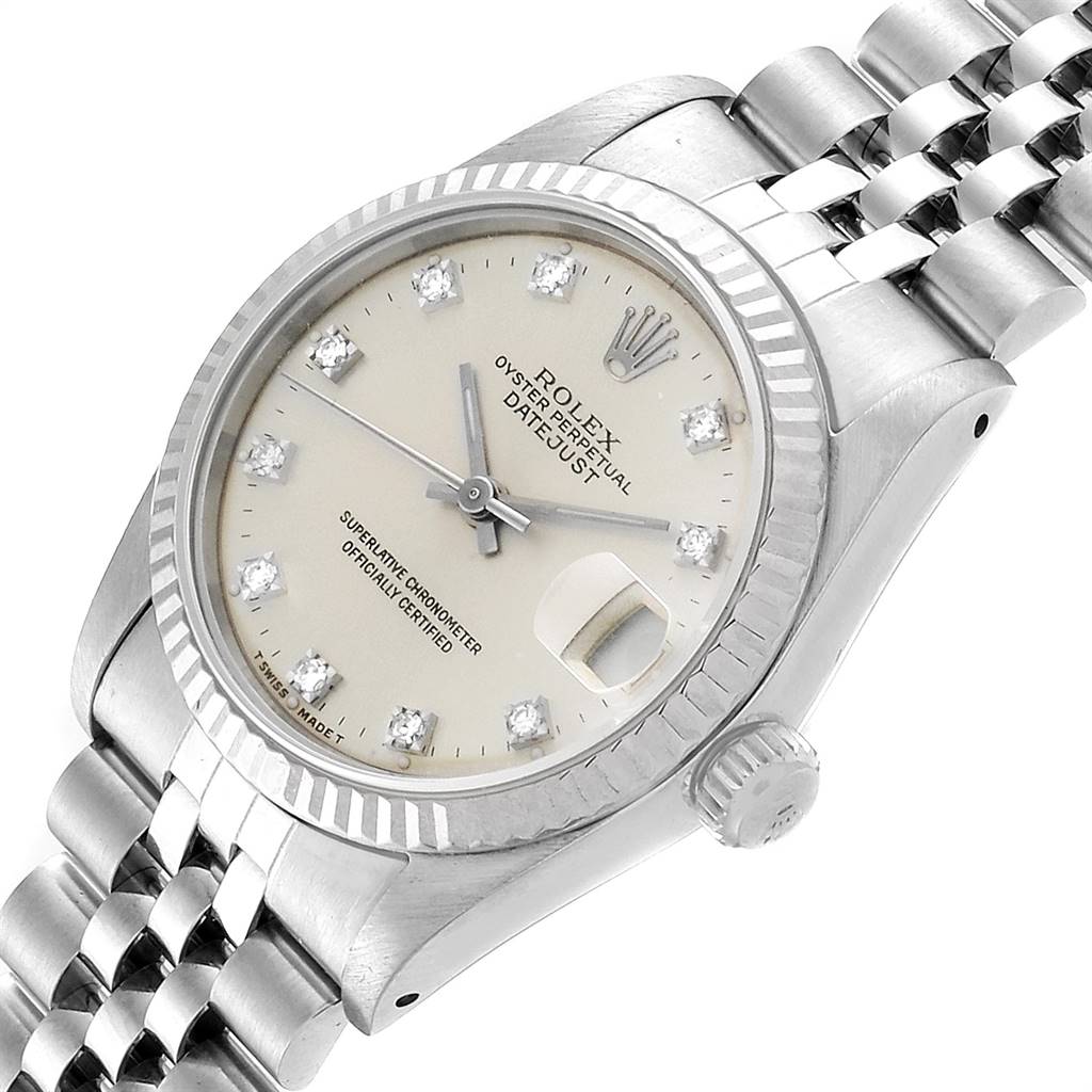 The image shows a close-up view of a Mid-Size Rolex Datejust watch, highlighting its dial, bezel, crown, and bracelet.