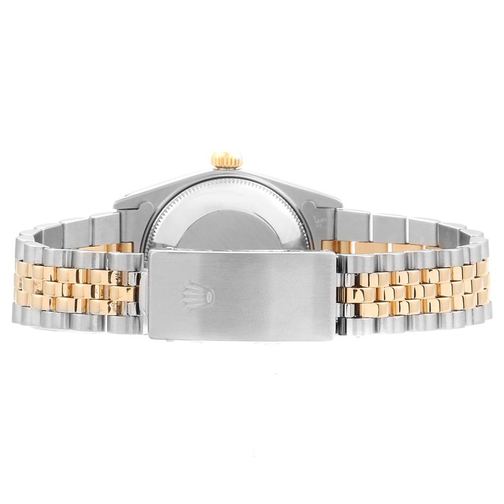 This image shows the back of a Mid-Size Rolex watch, including the bracelet and clasp.