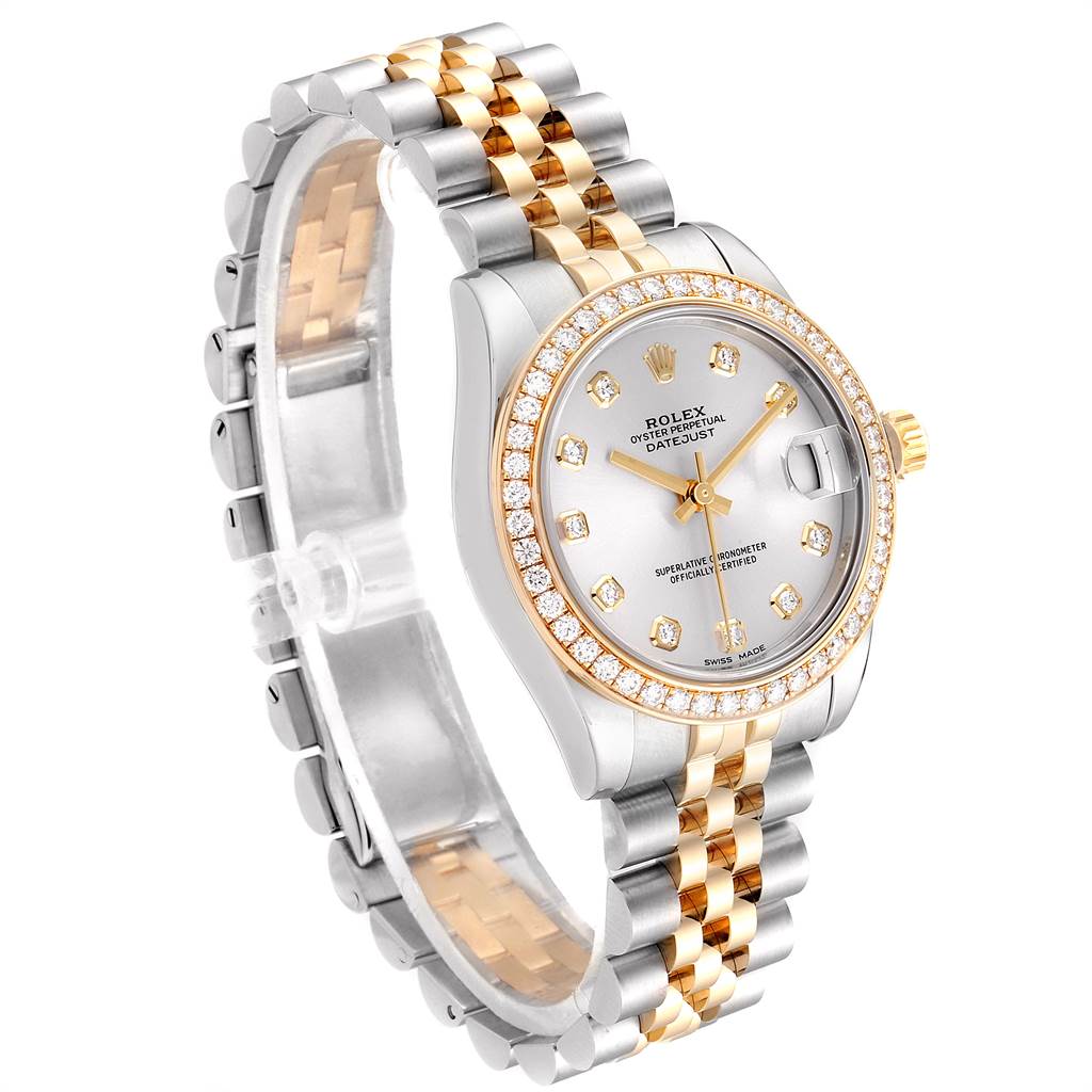 The Mid-Size Rolex watch is shown at an oblique angle, displaying its face, bezel, and two-tone bracelet.