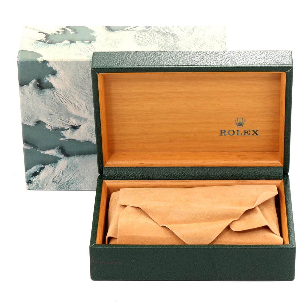 The image shows an open Rolex watch box with a covered Mid-Size model inside and its outer packaging in the background.