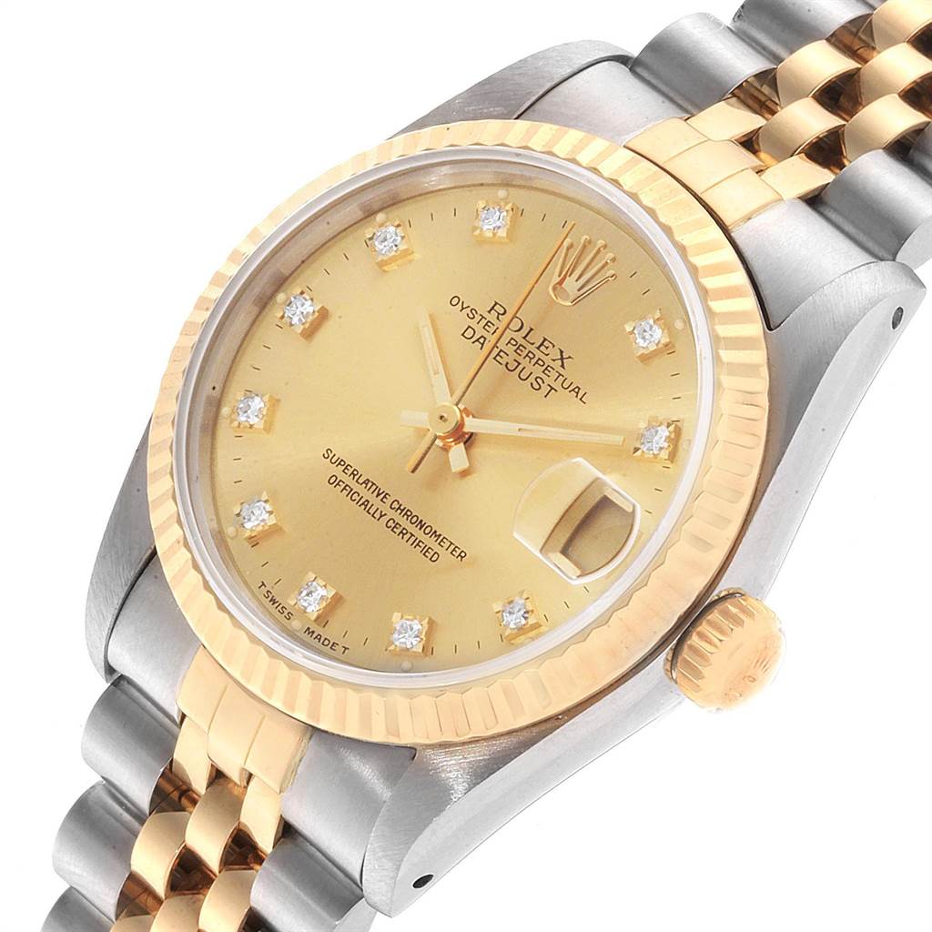 This image shows an angled view of a Rolex Mid-Size 68273 Women's Steel and Gold (two tone) Champagne Dial 68273 Women's Steel and Gold (two tone) Champagne Dial Datejust watch with a gold dial, diamond hour markers, and a two-tone bracelet.