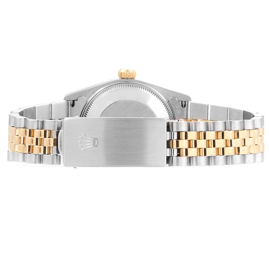 The Rolex Mid-Size 68273 Women's Steel and Gold (two tone) Champagne Dial 68273 Women's Steel and Gold (two tone) Champagne Dial model watch is shown from the back, highlighting the clasp, crown, and two-tone bracelet.