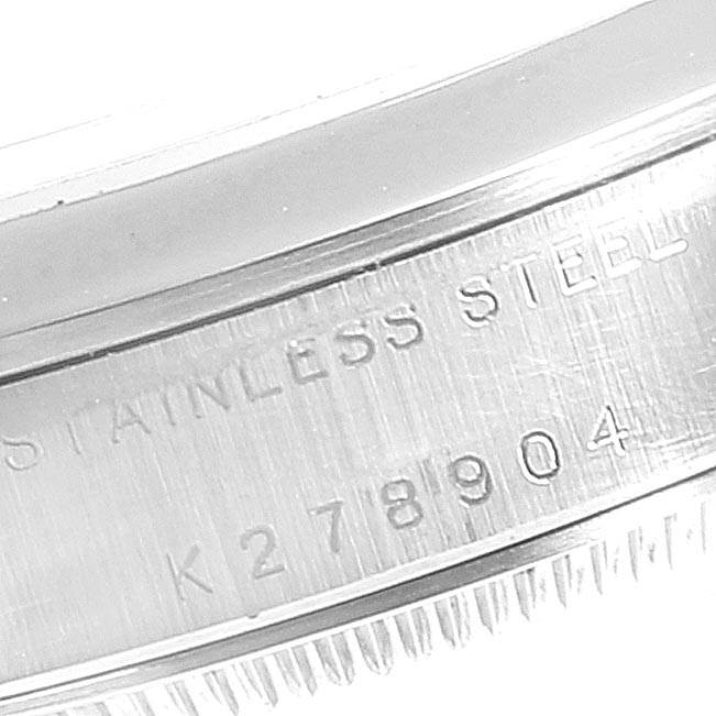 This close-up image of the Rolex Mid-Size 78240 Women's Stainless Steel Black Dial 78240 Women's Stainless Steel Black Dial watch shows the side view of its stainless steel case and part of its model number.