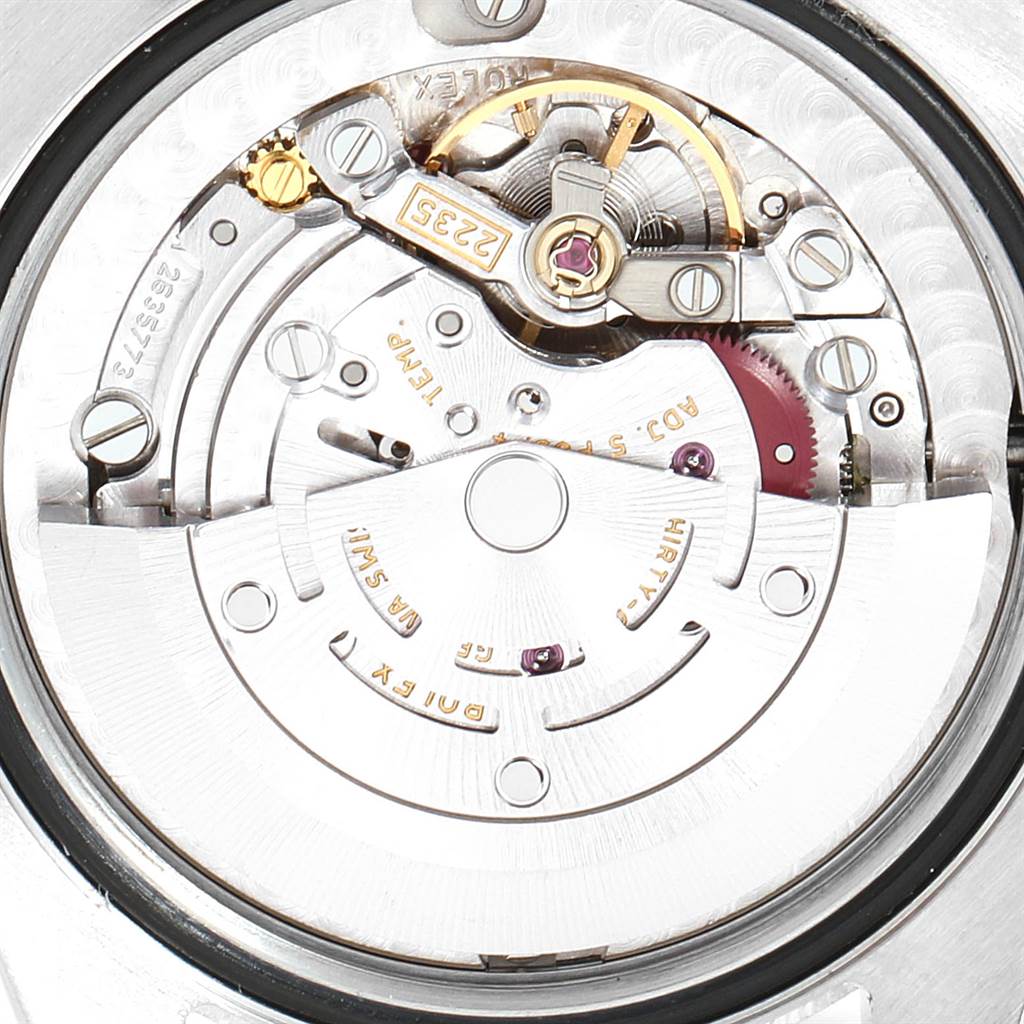 This is a close-up view of the Rolex Mid-Size 178341 Women's Steel and Gold (two tone) Mother of Pearl Dial 178341 Women's Steel and Gold (two tone) Mother of Pearl Dial watch's movement, featuring intricate gears and components.