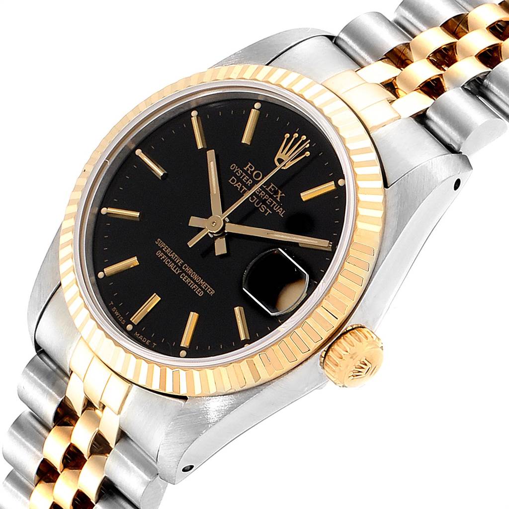 This image shows a close-up view of a Rolex Mid-Size 68273 Women's Steel and Gold (two tone) Black Dial 68273 Women's Steel and Gold (two tone) Black Dial Datejust watch, emphasizing its black dial, gold bezel, and two-tone bracelet.