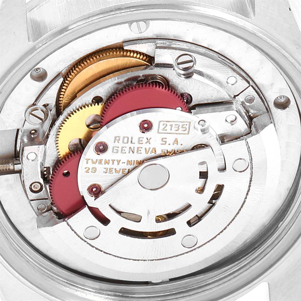 This image shows a close-up of the movement and internal mechanisms of a Rolex Mid-Size 68273 Women's Steel and Gold (two tone) Black Dial 68273 Women's Steel and Gold (two tone) Black Dial model watch.