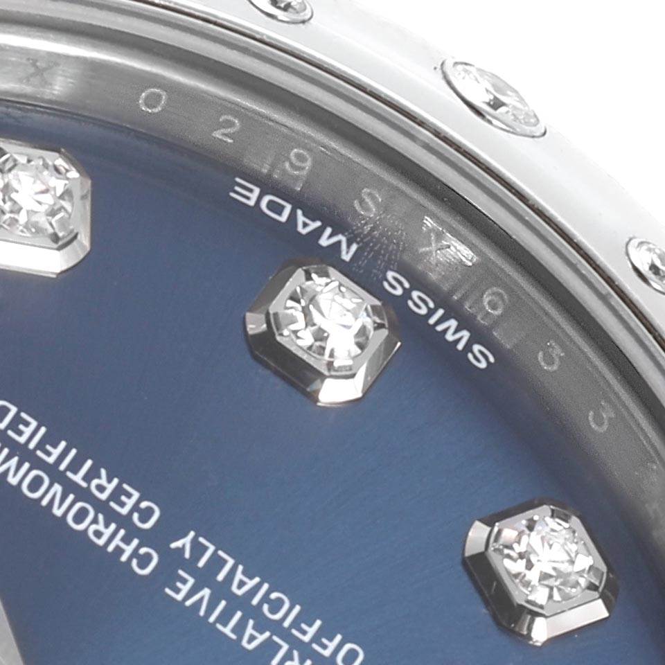 The image shows a close-up of the dial and bezel of a Mid-Size Rolex watch, highlighting diamond hour markers.