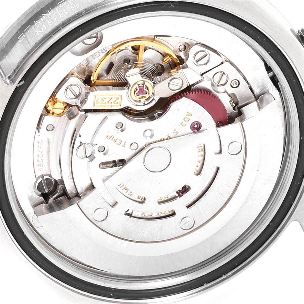 This image shows the internal mechanism of a mid-size Rolex watch from a close-up, top-down angle.