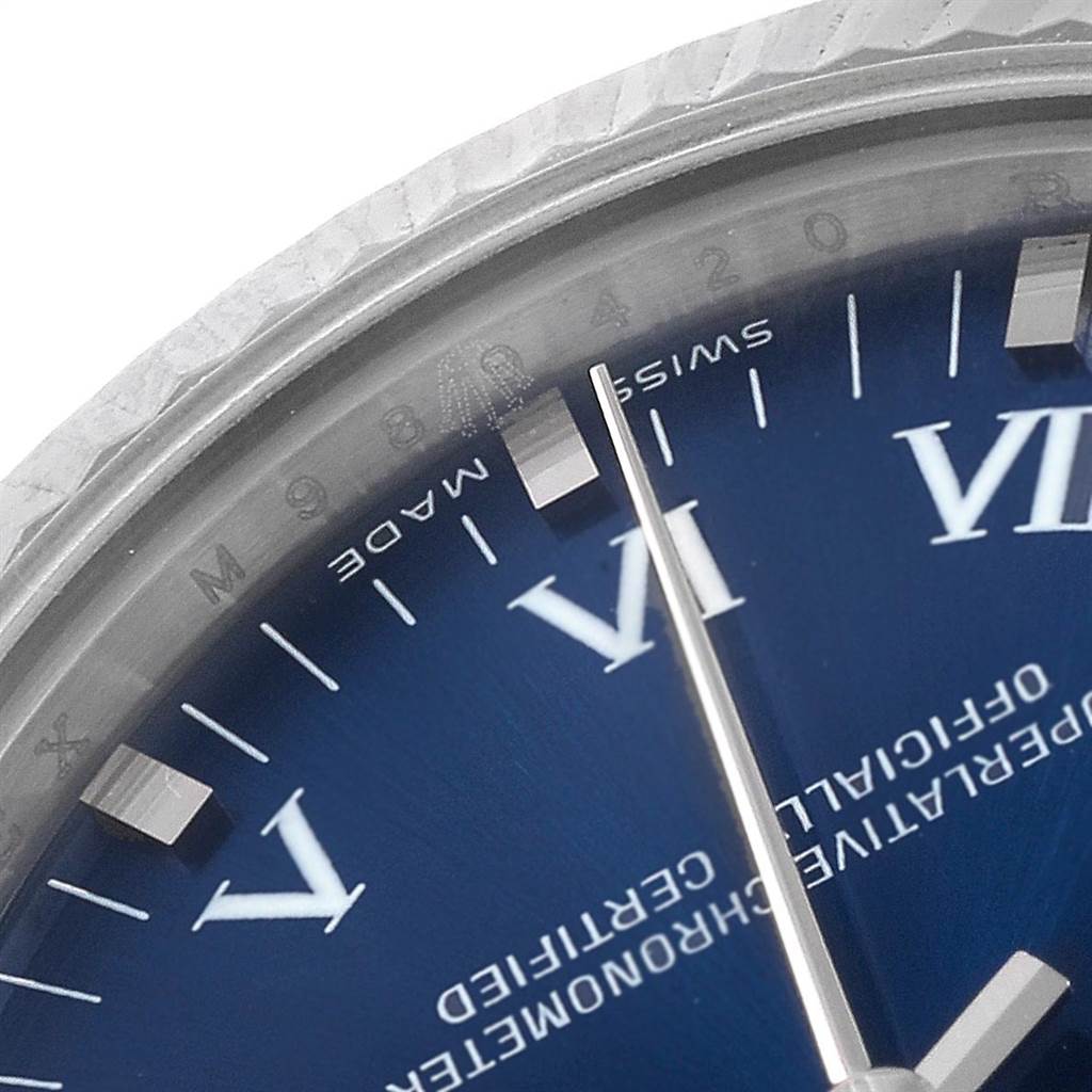 This image shows a close-up view of the dial, numerals, and the second hand of a Mid-Size Rolex watch.