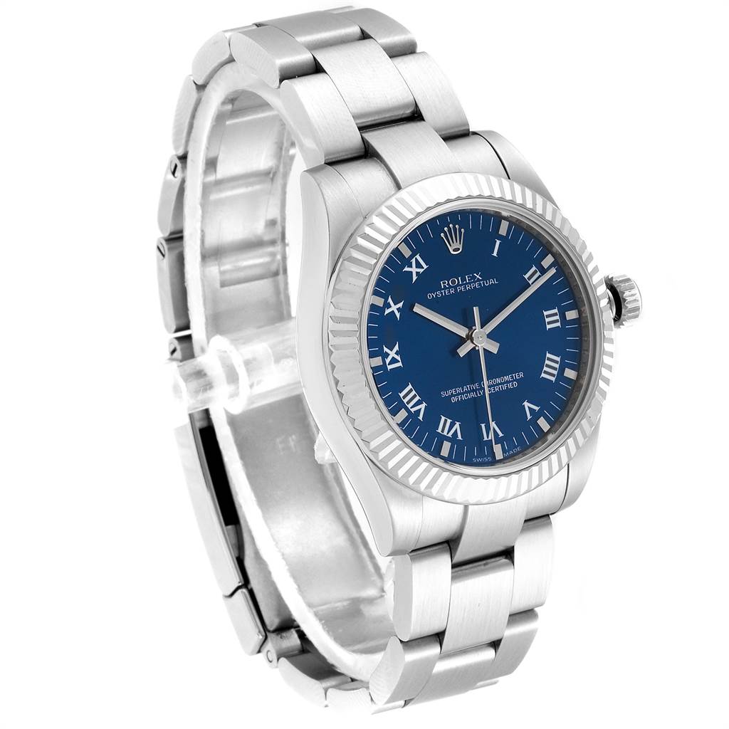 This image shows a Rolex Mid-Size 177234 Women's Stainless Steel Blue Dial 177234 Women's Stainless Steel Blue Dial model watch angled to display its blue dial, fluted bezel, and stainless steel bracelet.