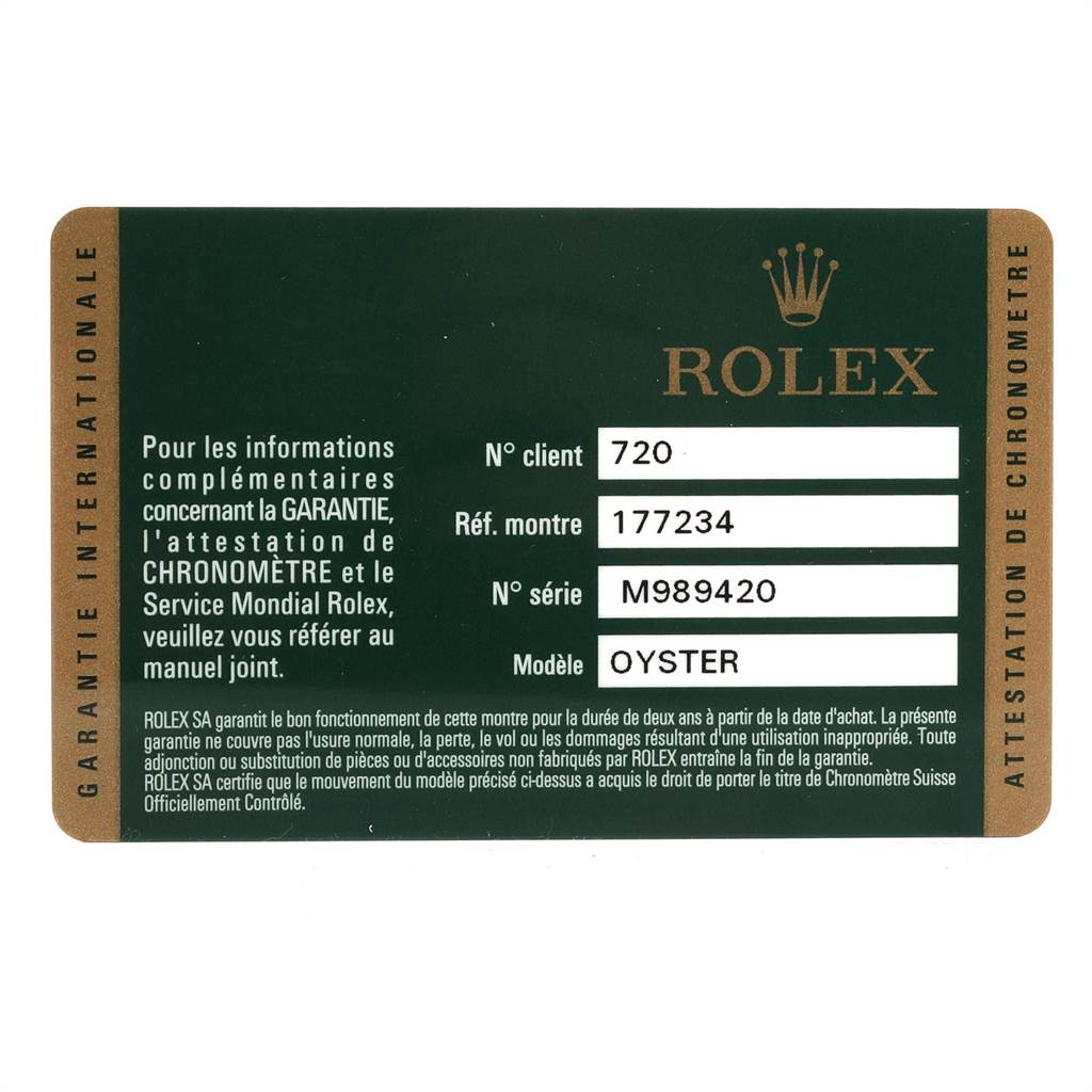 This image shows the warranty card for the Rolex Oyster Mid-Size model, including reference and serial numbers.