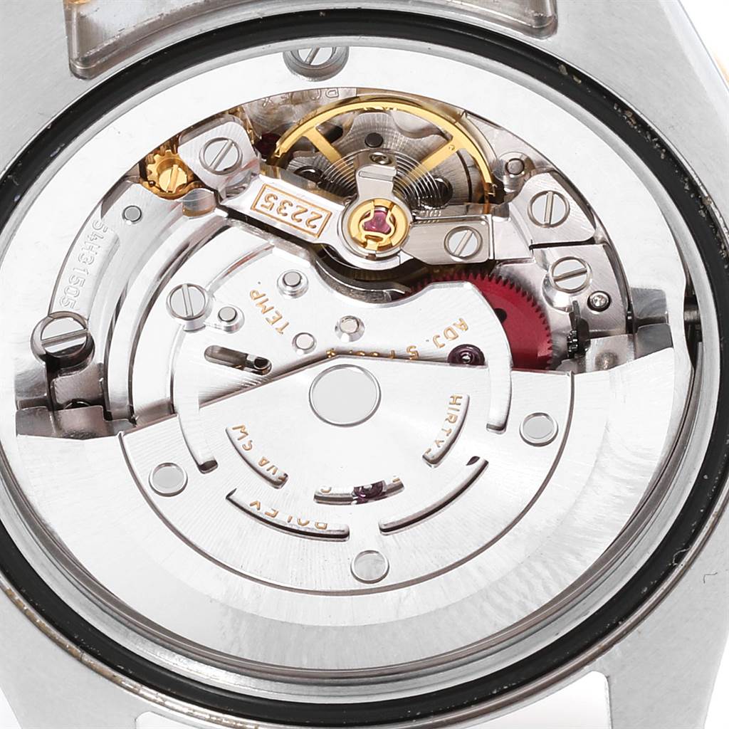 The image shows the internal mechanism of a Mid-Size Rolex watch, viewed from the back.