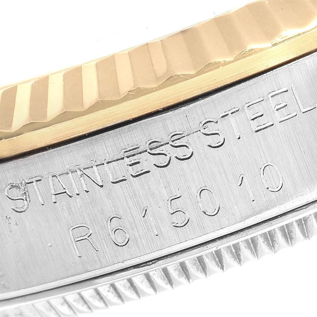 The angle shows the side of a Rolex Mid-Size 68273 Women
s Steel and Gold (two tone) White Dial 68273 Women
s Steel and Gold (two tone) White Dial model watch, displaying the stainless steel engraving and part of the gold bezel.