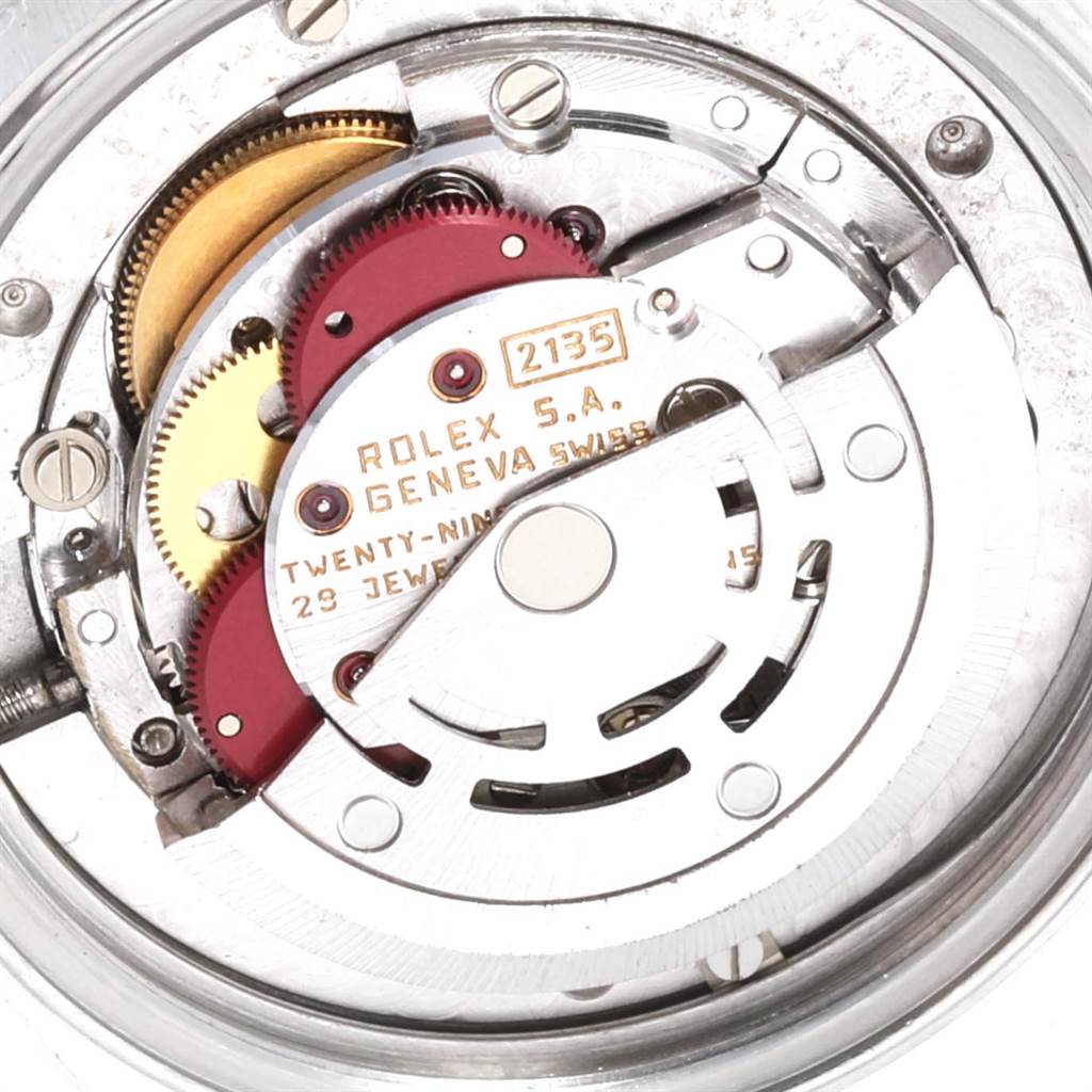 This image shows the internal mechanism and movement of a Mid-Size Rolex watch from a top-down angle.