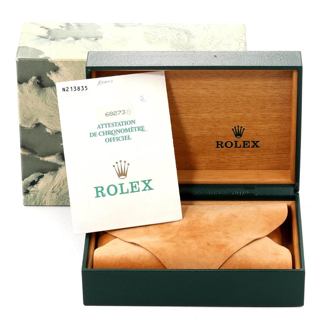 The image shows the opened box and certificate of a Mid-Size Rolex watch, with the watch itself in a suede pouch inside the box.