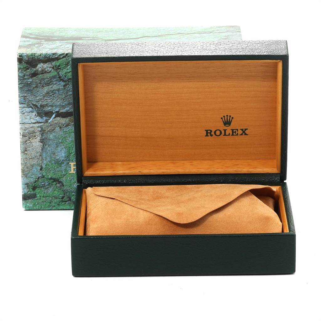 This is a front view of a Rolex Mid-Size 68273 Women's Steel and Gold (two tone) Black Dial 68273 Women's Steel and Gold (two tone) Black Dial watch box, showing the inside with a suede cushion and the Rolex logo.