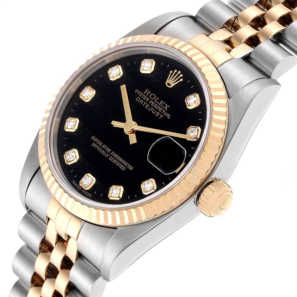 The image shows a close-up angle of the Rolex Mid-Size 68273 Women's Steel and Gold (two tone) Black Dial 68273 Women's Steel and Gold (two tone) Black Dial Datejust, highlighting the black dial, gold bezel, and two-tone bracelet.