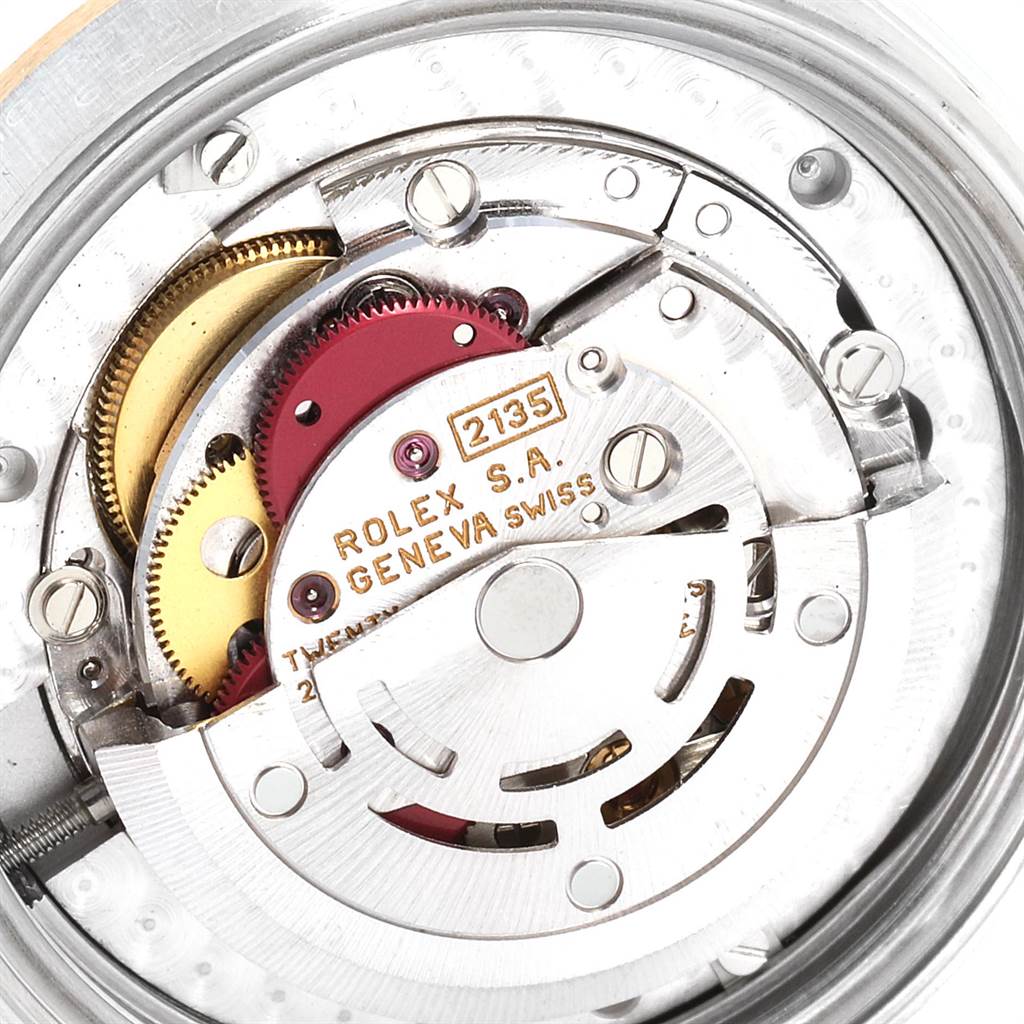 This close-up image shows the inner mechanical movement of a Mid-Size Rolex watch.