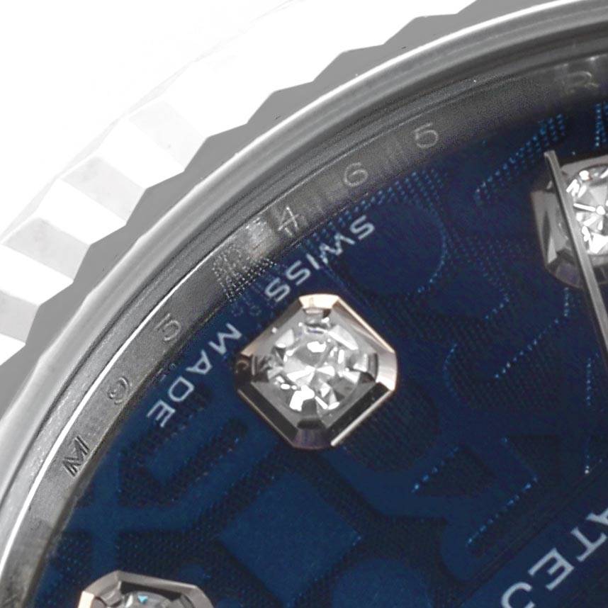 This close-up shows part of the dial, hands, and diamond markers of a Rolex Mid-Size 178274 Women's Stainless Steel Blue Dial 178274 Women's Stainless Steel Blue Dial model watch.