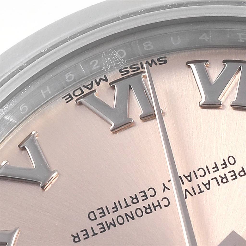 This image shows a close-up of the dial, hands, and Roman numeral markers of a Mid-Size Rolex watch.