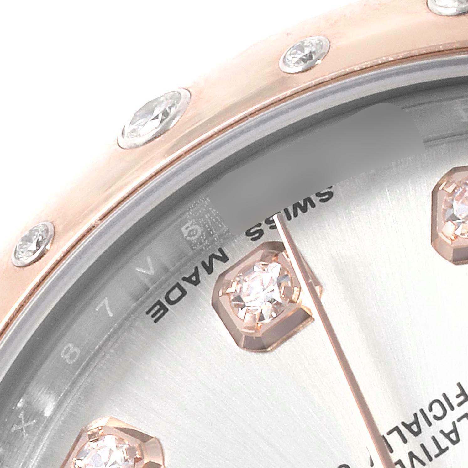 This close-up image of the Rolex Mid-Size 178341 Women's Steel and Gold (two tone) Silver Dial 178341 Women's Steel and Gold (two tone) Silver Dial model watch shows a portion of the bezel with diamond accents and partial dial with "Swiss Made" text.
